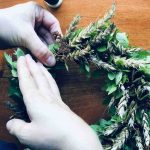 Natural wreath with blueberry branches and wheat stalks.