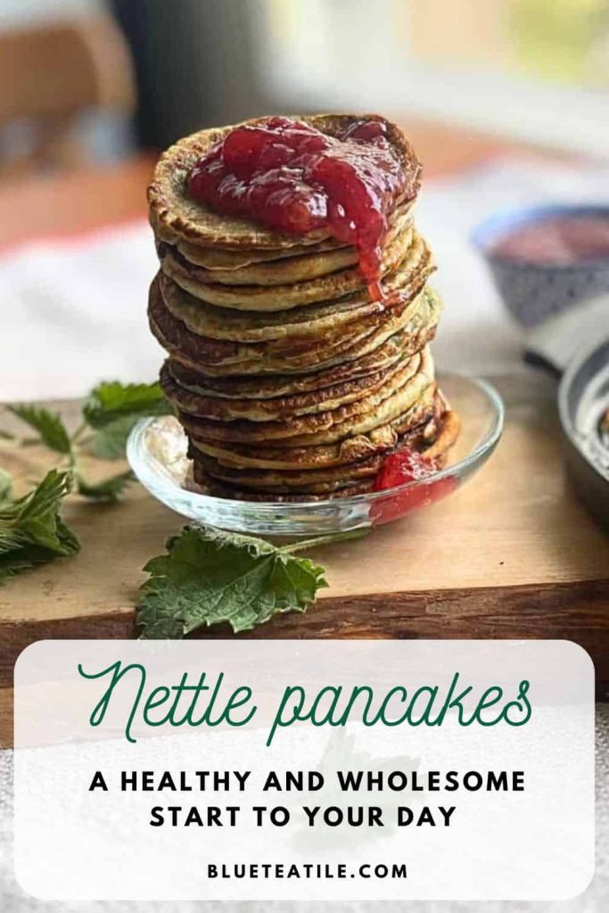 A huge pile of nettle pancakes with raspberry jam dripping down.