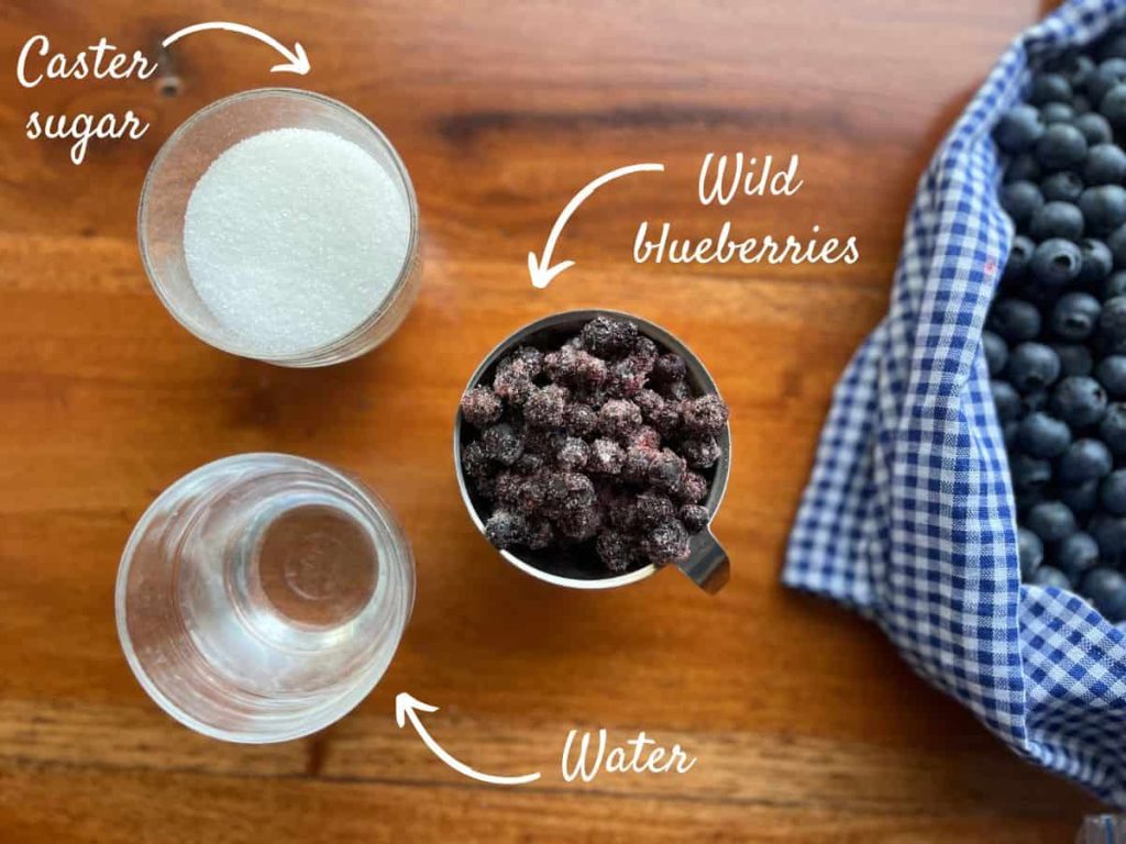 Ingredients for wild blueberry syrup: frozen blueberries, caster sugar and water.